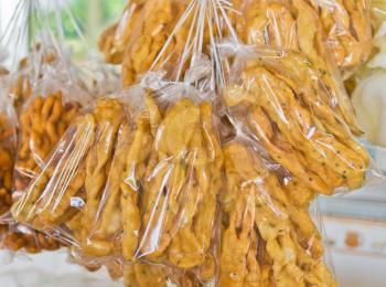 Bread sticks with spices in transparent bag