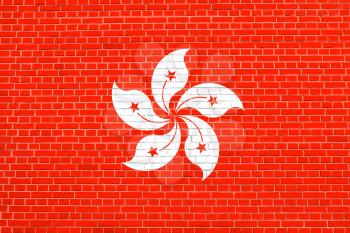 Flag of Hong Kong on brick wall texture background. The Hong Kong is special administrative region of the People's Republic of China.