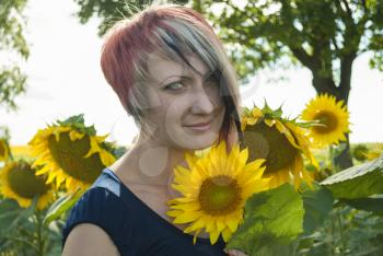 Beautiful girl in a field of sunflowers.