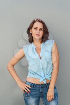 Beautiful girl on a gray background.