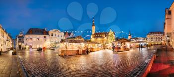Traditional Christmas Market On Town Hall Square - Raekoja Plats In Tallinn, Estonia. Christmas Tree And Trading Houses With Sale Of Christmas Gifts, Sweets And Mulled Wine. Famous Landmark.