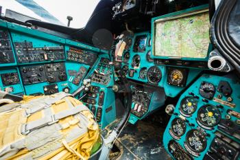 Close-up of some instruments in a helicopter cockpit in Mi-24. The Mil Mi-24 is a large helicopter gunship and attack helicopter and low-capacity troop transport with room for eight passengers.