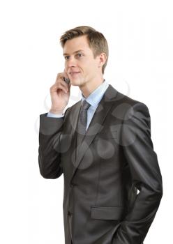 Businessman talking on a mobile phone. isolated on white