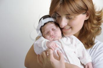 happy mother with newborn baby closeup