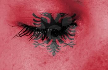 Crying woman, pain and grief concept, flag of Albania