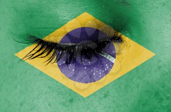 Crying woman, pain and grief concept, flag of Brazil
