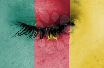 Crying woman, pain and grief concept, flag of Cameroon