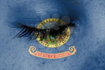 Crying woman, pain and grief concept, flag of Idaho
