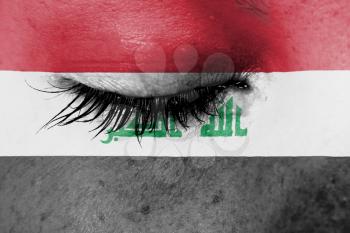 Crying woman, pain and grief concept, flag of Iraq