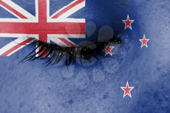 Crying woman, pain and grief concept, flag of New Zealand