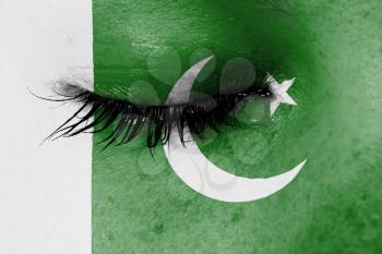 Crying woman, pain and grief concept, flag of Pakistan