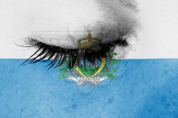 Crying woman, pain and grief concept, flag of San Marino