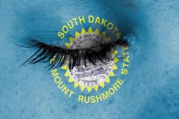 Crying woman, pain and grief concept, flag of South Dakota
