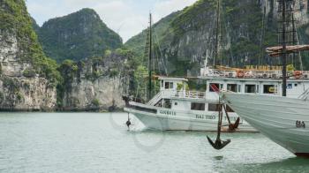 HA LONG BAY, VIETNAM AUG 10, 2012. Tourist Boats in Ha Long Bay. Ha Long Bay is one of the seven world wonders. Vietnam, August 10, 2012