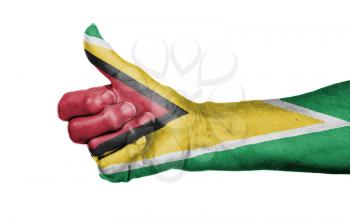 Old woman giving the thumbs up sign, isolated, flag of Guyana