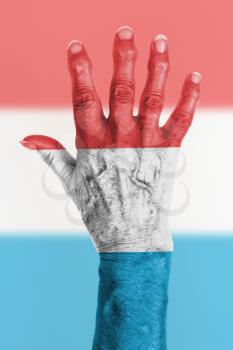 Isolated old hand with flag, European Union, Luxembourg