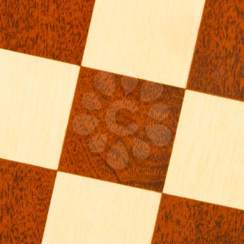 Very old wooden chess board, isolated close-up