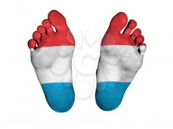 Feet with flag, sleeping or death concept, flag of Luxembourg