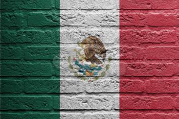 Brick wall with a painting of a flag isolated, Mexico