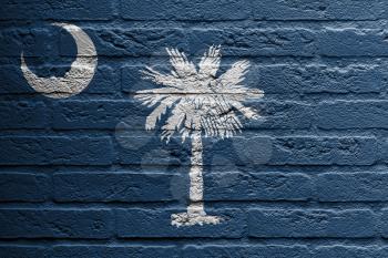Brick wall with a painting of a flag isolated, South Carolina
