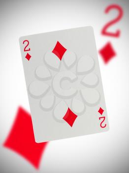 Playing card with a blurry background, two
