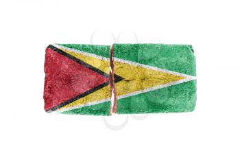 Rough broken brick, isolated on white background, flag of Guyana