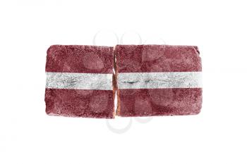 Rough broken brick, isolated on white background, flag of Latvia