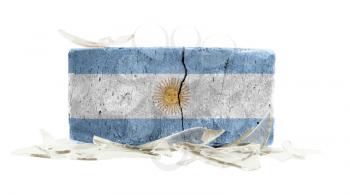 Brick with broken glass, violence concept, flag of Argentina