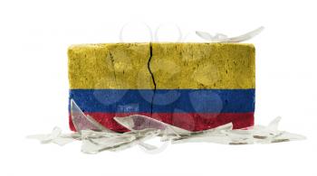 Brick with broken glass, violence concept, flag of Colombia