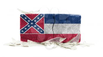 Brick with broken glass, violence concept, flag of Mississippi