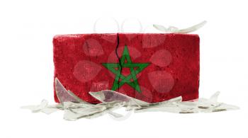 Brick with broken glass, violence concept, flag of Morocco