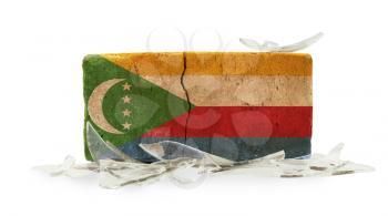 Brick with broken glass, violence concept, flag of The Comoros