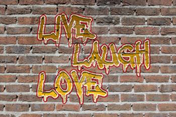 Old dark red brick wall texture with graffity, live laugh love