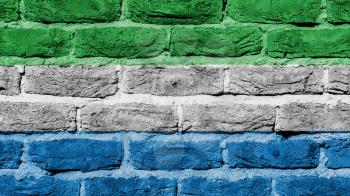 Very old brick wall texture, flag of Sierra Leone