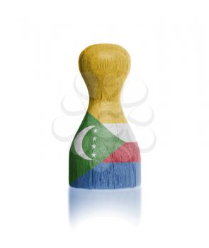 Wooden pawn with a painting of a flag, the Comoros