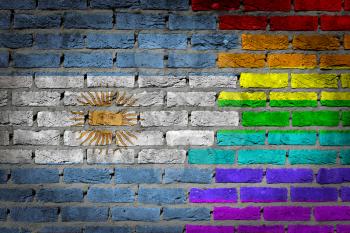 Dark brick wall texture - coutry flag and rainbow flag painted on wall - Argentina