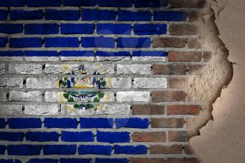 Dark brick wall texture with plaster - flag painted on wall - El Salvador