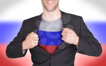 Businessman opening suit to reveal shirt with flag, Russia