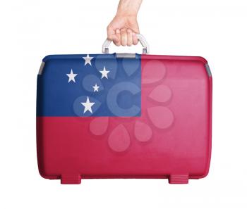 Used plastic suitcase with stains and scratches, printed with flag, Samoa