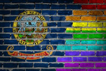 Dark brick wall texture - coutry flag and rainbow flag painted on wall - Idaho