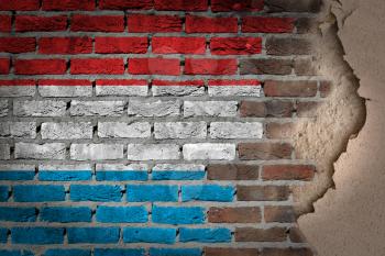 Dark brick wall texture with plaster - flag painted on wall - Luxembourg