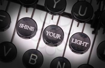 Typewriter with special buttons, shine your light