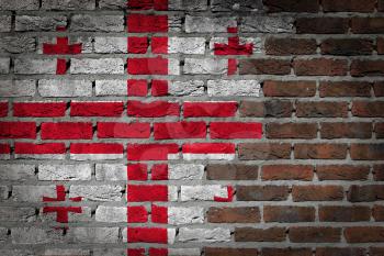 Very old dark red brick wall texture with flag - Georgia