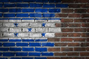 Very old dark red brick wall texture with flag - Honduras