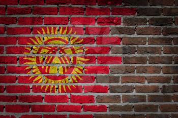 Very old dark red brick wall texture with flag - Kyrgyzstan