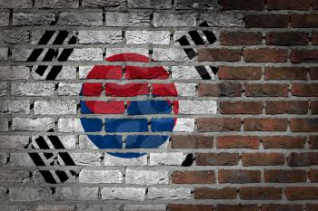 Very old dark red brick wall texture with flag - South Korea