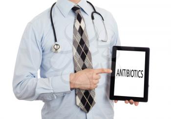 Doctor, isolated on white backgroun,  holding digital tablet - Antibiotics
