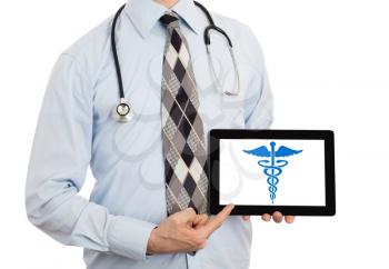 Doctor holding tablet, isolated on white - Caduceus symbol