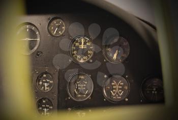 Different meters and displays in the console of an old plane