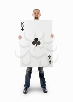 Businessman with large playing card - King of clubs